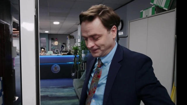 Video Reference: Tie, Coat, Automotive design, Suit, Blazer, Gadget, White-collar worker, Event, Formal wear, Audio equipment