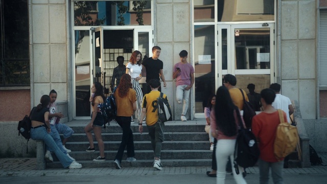 Video Reference: Jeans, Trousers, Shoe, Shorts, Window, Building, Luggage and bags, Bag, Public space, Thigh