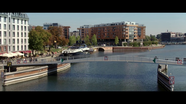 Video Reference: Water, Building, Sky, Daytime, Boat, Vehicle, Window, Watercraft, Urban design, Neighbourhood