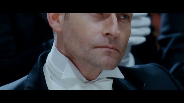 Video Reference: Forehead, Nose, Cheek, Mouth, Dress shirt, Flash photography, Jaw, Sleeve, Gesture, Collar