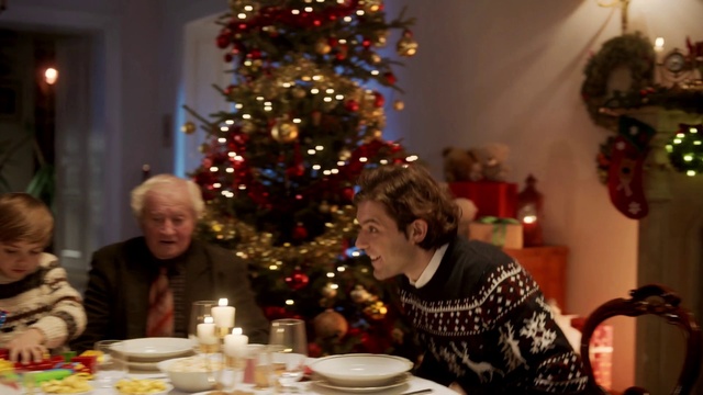 Video Reference: Christmas tree, Photograph, Christmas ornament, Tableware, Lighting, Interior design, Table, Christmas dinner, Holiday ornament, Ornament