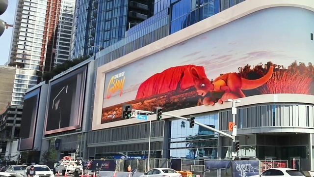 Video Reference: Building, Wheel, Car, Tire, Window, Vehicle, Billboard, Architecture, Facade, Landmark