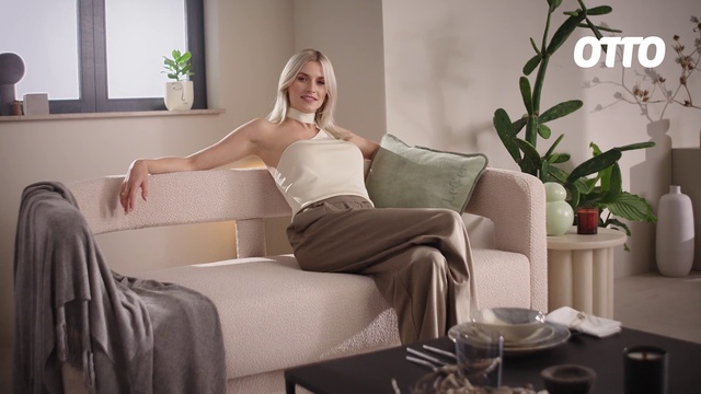Video Reference: Hairstyle, Arm, Shoulder, Furniture, Plant, Smile, Leg, Comfort, Couch, Window