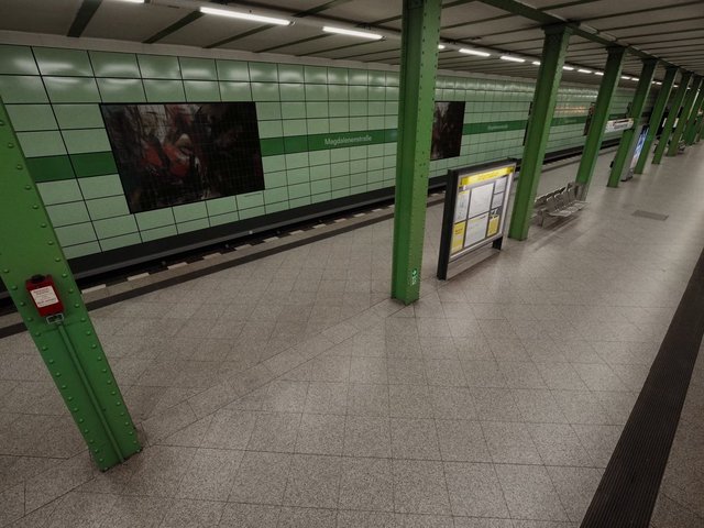 Video Reference: subway, metro, underground, platform, empty, station, public transport, tiles, green columns, bench, signage, urban, interior, commute