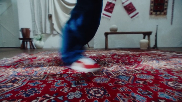 Video Reference: Flooring, Red, Floor, Knee, Electric blue, Human leg, Thigh, Pattern, Carpet, Art
