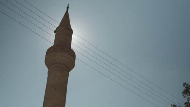 Video Reference: Sky, Building, Electricity, Finial, Tree, Tower, Overhead power line, Steeple, Electrical supply, Skyscraper