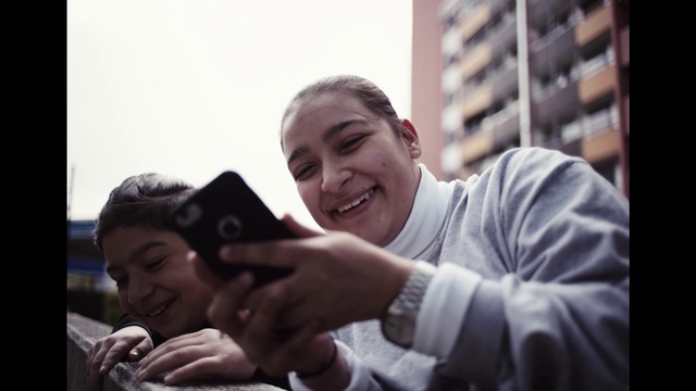 Video Reference: Smile, Hand, Flash photography, Happy, Gesture, Eyewear, Fun, Event, T-shirt, Mobile phone