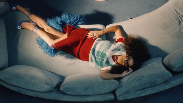 Video Reference: Hand, Arm, Leg, Comfort, Human body, Flash photography, Couch, Thigh, Gesture, Happy