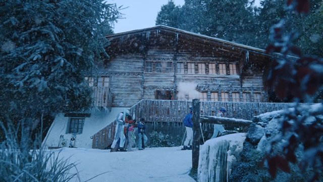 Video Reference: snow, winter, chalet, lodge, wooden house, trees, skiers, outdoor, mountain, cold, snowy landscape, rustic, travel, vacation, people, steam