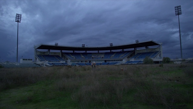 Video Reference: Cloud, Sky, Plant, Street light, Grass, Landscape, Stadium, Sport venue, Slope, Horizon