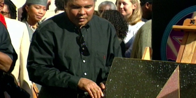 Video Reference: Organ, Hat, Microphone, Event, Job, Conversation, Eyewear, Cap, T-shirt, Jewellery