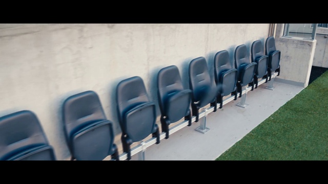 Video Reference: Chair, Automotive design, Rectangle, Gas, Font, Electric blue, Automotive exterior, Auto part, Event, Bumper