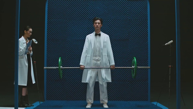 Video Reference: Suit trousers, Coat, Sleeve, Entertainment, Chair, Blazer, Sports equipment, Event, Public speaking, Fashion design