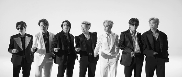 Video Reference: Clothing, Suit trousers, Trousers, Hairstyle, Coat, Fashion, Sleeve, Standing, Gesture, Suit