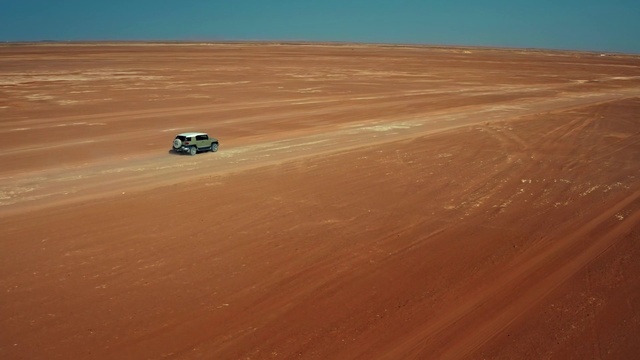 Video Reference: Sky, Tire, Vehicle, Ecoregion, Car, Erg, Automotive tire, Rolling, Horizon, Singing sand