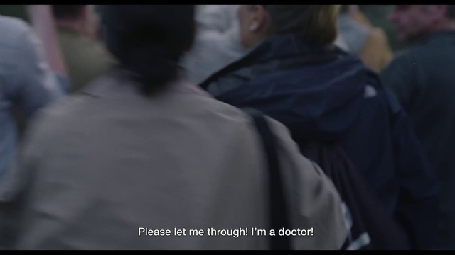 Video Reference: Sleeve, Font, Event, T-shirt, Darkness, Photo caption, Crowd, Street fashion, Formal wear, Fur