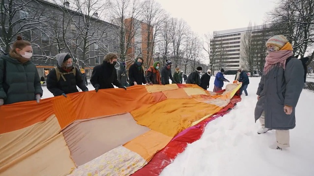 Video Reference: Outerwear, Coat, Sky, Orange, Tree, Sun hat, Jacket, Recreation, Leisure, Hat