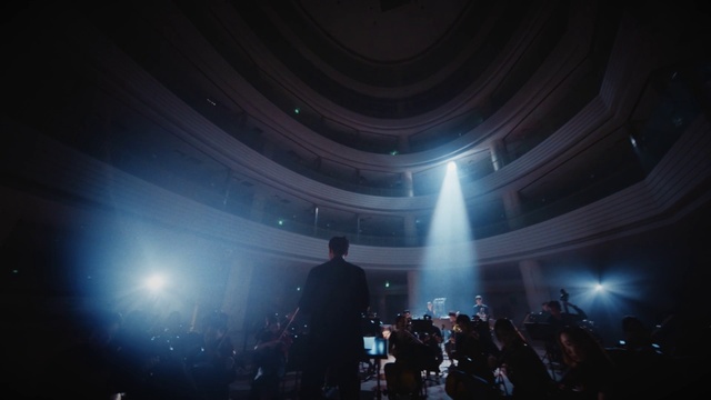 Video Reference: Entertainment, Performing arts, Electric blue, Lens flare, Space, Event, Music venue, Magenta, Darkness, Stage