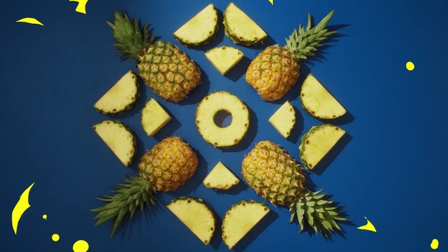 Video Reference: pineapple, fruit, tropical, sliced, whole, top view, flat lay, blue background, food, fresh, pattern, arrangement, still life, bright, yellow, decorative