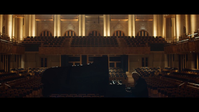 Video Reference: Building, Urban design, Landmark, Facade, Font, City, Audio equipment, Darkness, House, Symmetry