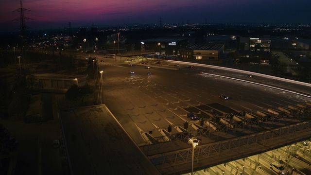 Video Reference: Sky, Road surface, Street light, Urban design, Air travel, Horizon, Landscape, Dusk, Electricity, Road