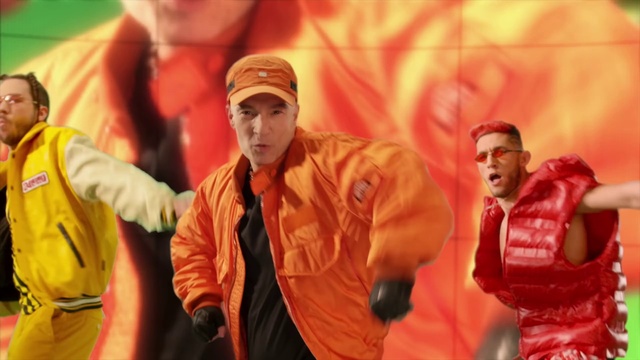 Video Reference: Orange, Gesture, Performing arts, Entertainment, Hat, Fun, Performance art, Music, Event, Cap