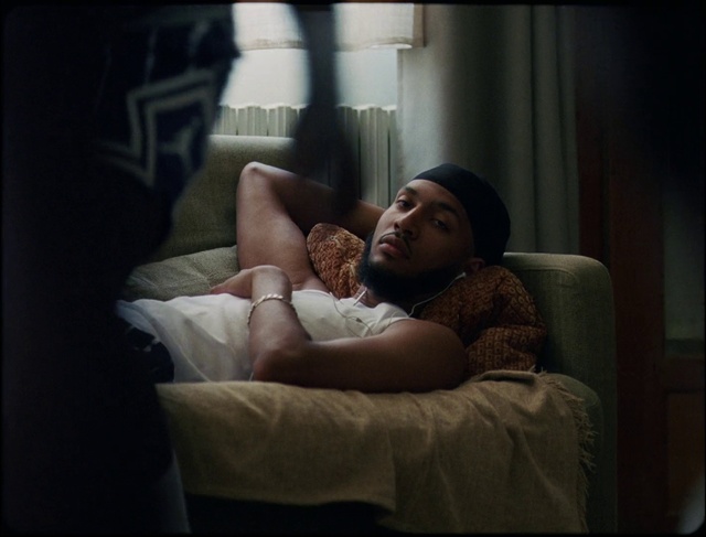 Video Reference: Arm, Leg, Comfort, Human body, Flash photography, Thigh, Couch, Lamp, Linens, Pillow