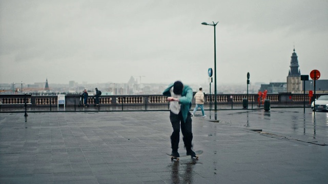 Video Reference: Sky, Cloud, Street light, Travel, Asphalt, Road surface, Sports equipment, Horizon, Rolling, Street fashion