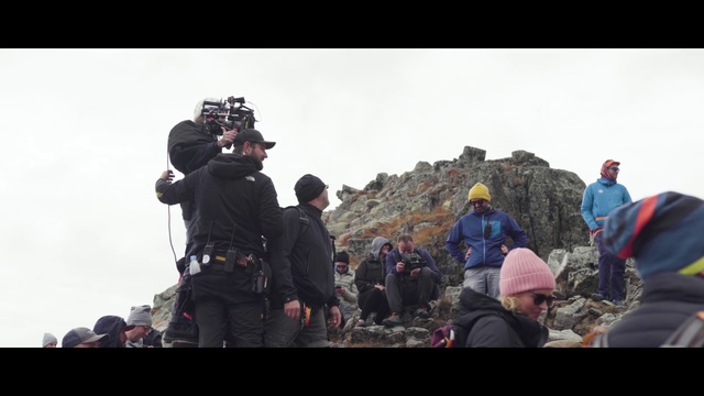 Video Reference: Sky, Travel, Camera, Videographer, Mountain, Video camera, Tire, Recreation, Event, Landscape