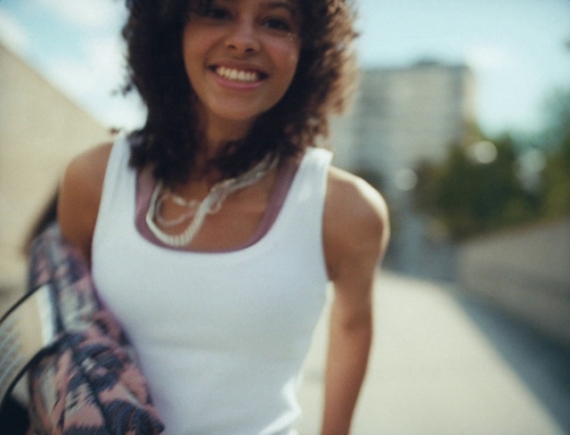 Video Reference: Smile, Active tank, Shoulder, camisoles, Undershirt, Neck, Flash photography, Happy, Street fashion, Eyewear