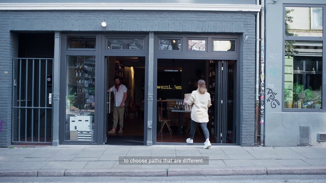 Video Reference: Door, Standing, Building, Fixture, Facade, Sidewalk, City, Retail, Pedestrian, Street