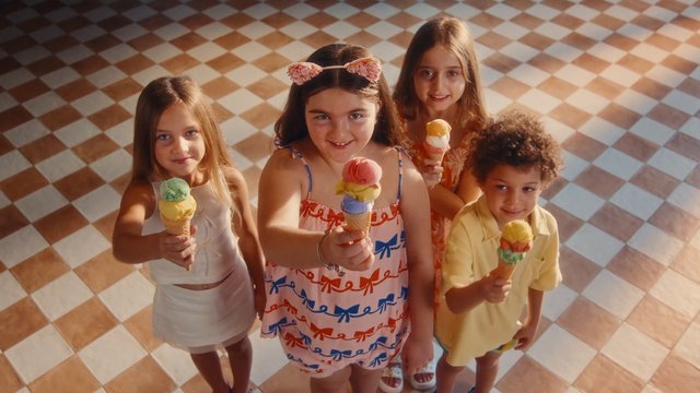 Video Reference: children, ice cream, cones, indoor, group, friends, smiling, overhead view, tiled floor, summer, dessert, colorful, lifestyle