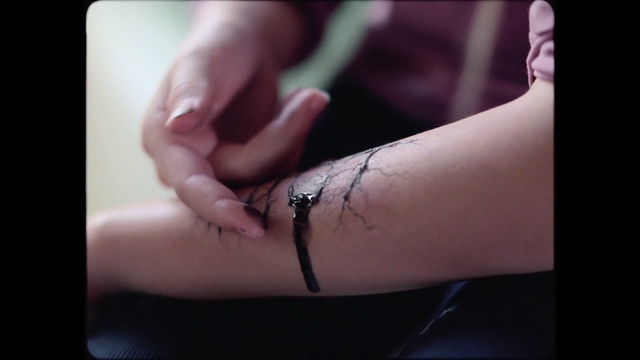 Video Reference: Sleeve, Gesture, Elbow, Finger, Nail, Temporary tattoo, Thumb, Font, Wrist, Knee