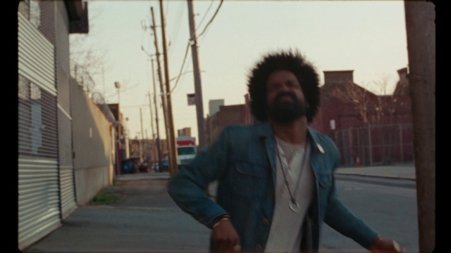 Video Reference: Hairstyle, Sky, Beard, Dress shirt, Standing, Street fashion, Eyewear, Cool, Road, Asphalt