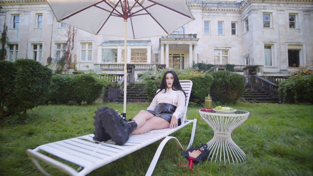 Video Reference: Plant, Window, White, Building, Shorts, Outdoor furniture, Grass, Comfort, Leisure, Public space