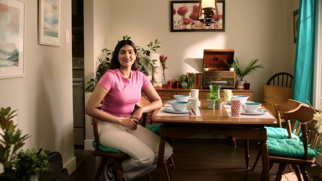 Video Reference: Smile, Plant, Picture frame, Furniture, Table, Houseplant, Green, Comfort, Chair, Lighting