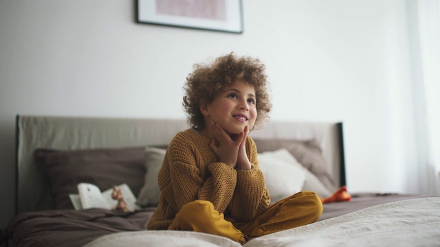 Video Reference: Hair, Face, Smile, Arm, Picture frame, Comfort, Human body, Happy, Flooring, Floor