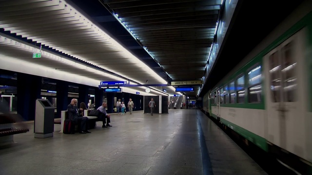 Video Reference: Transport hub, Fixture, Electricity, Building, Train, City, Metro station, Public transport, Electric blue, Road