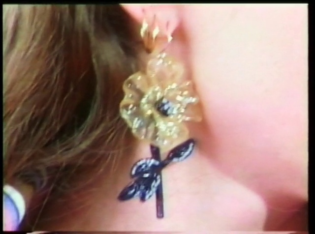 Video Reference: Eyelash, Body jewelry, Ear, Jaw, Organism, Gesture, Feather, Earrings, Nail, Black hair