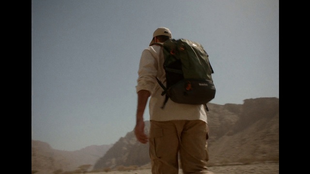 Video Reference: Shorts, Sky, Ecoregion, Atmospheric phenomenon, Travel, Luggage and bags, Mountain, Backpack, Landscape, Bag