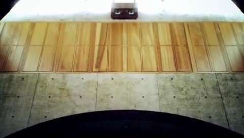 Video Reference: indoor, concrete, wooden slats, curved surface, architecture, abstract, minimal, wall, floor, texture, symmetry, centered, static, interior