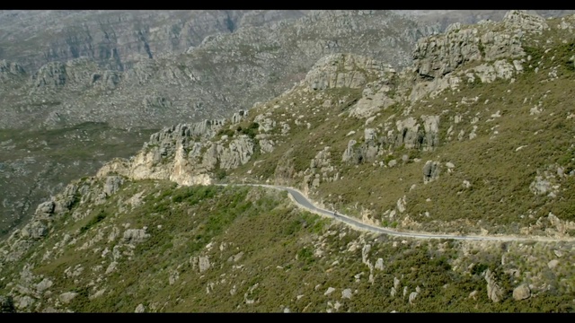 Video Reference: Mountain, Natural landscape, Bedrock, Slope, Terrain, Landscape, Formation, Grass, Grassland, Outcrop