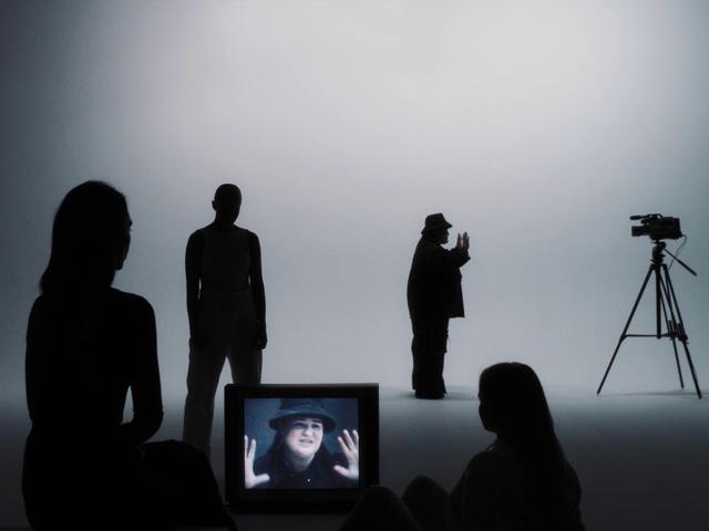 Video Reference: Outerwear, Coat, Flash photography, Fashion, Standing, Sky, Gesture, Interaction, Art, Event