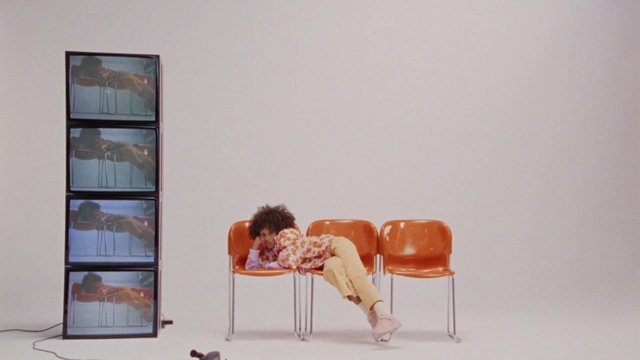 Video Reference: Furniture, Chair, Comfort, Orange, Shelf, Wood, Interior design, Couch, Wall, Knee