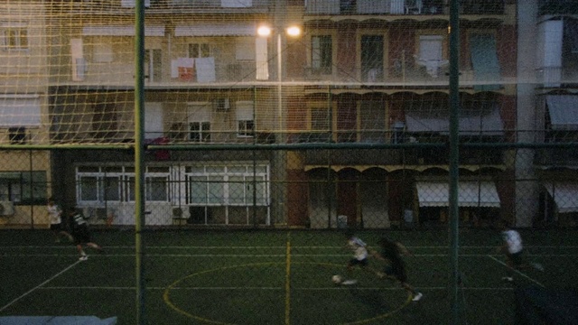 Video Reference: Window, Building, Soccer, Sports equipment, Football, Mesh, Player, Urban design, Grass, Ball