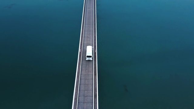 Video Reference: Water, Car, Concrete bridge, Vehicle, Cable-stayed bridge, Electric blue, Suspension bridge, Fixed link, Nonbuilding structure, Bridge