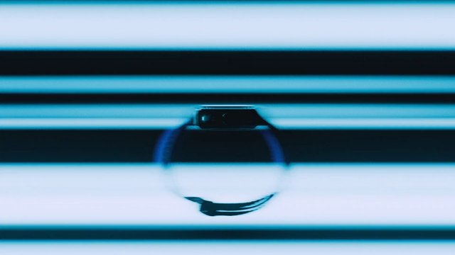 Video Reference: abstract, blurred, close-up, dark object, horizontal stripes, blue, reflection, macro, minimal, pattern, out of focus, symmetry, geometric, technology, screen