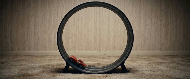 Video Reference: toy car, loop track, motion blur, indoor, empty room, carpet, wallpaper, circular track, playset, racing, toy, minimal scene, centered composition