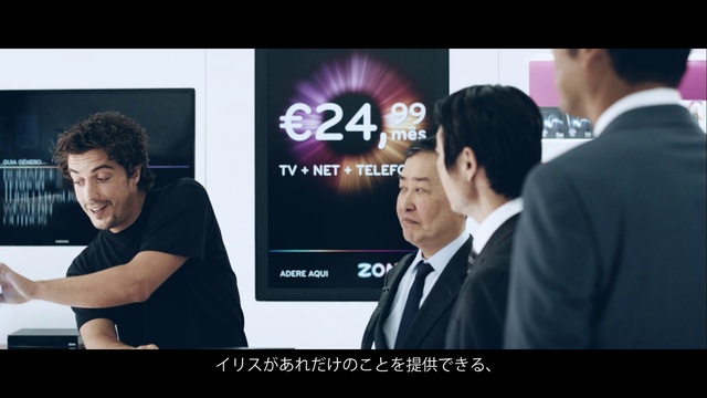 Video Reference: Product, Coat, Flash photography, Gadget, Font, Suit, Display device, Formal wear, Electronic device, Event