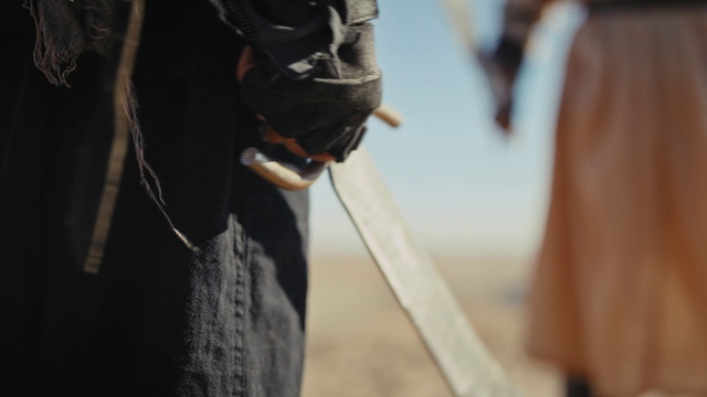 Video Reference: Gesture, Helmet, Wood, Art, Elbow, Automotive tire, Personal protective equipment, Tradition, Recreation, Metal